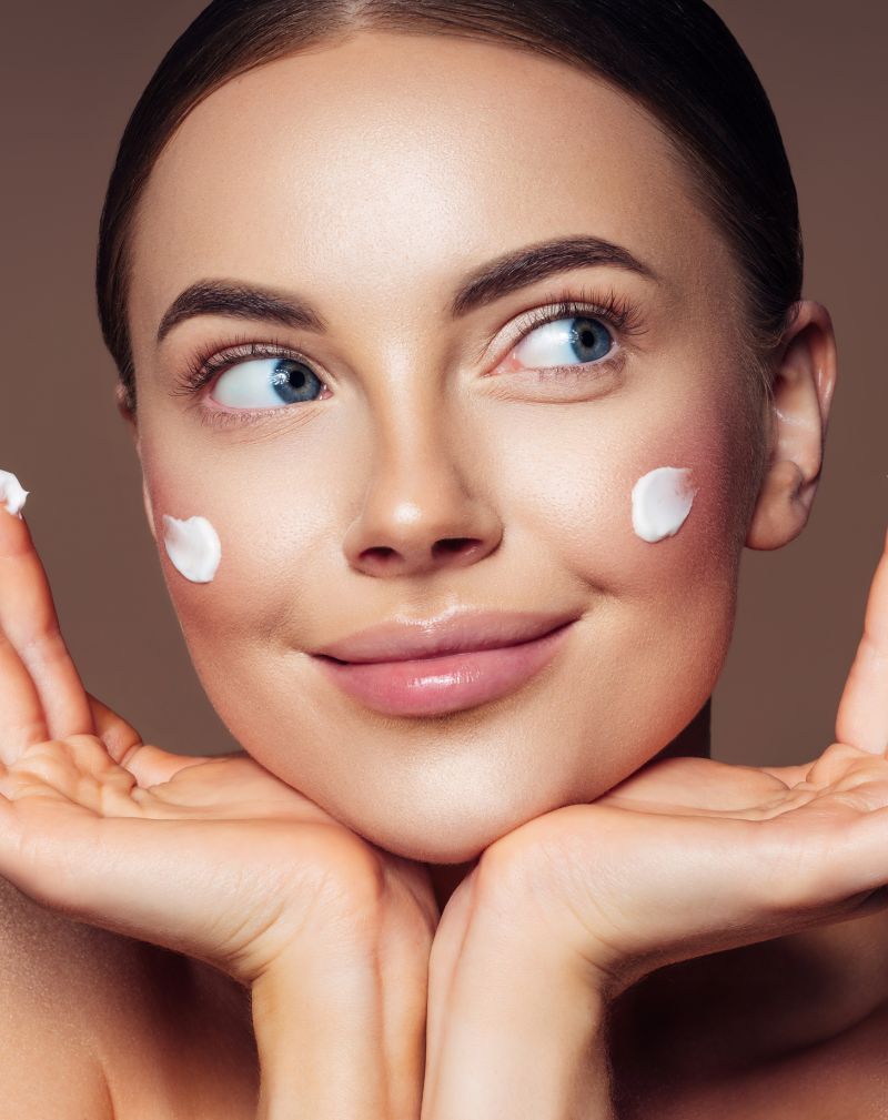 woman applying face cream