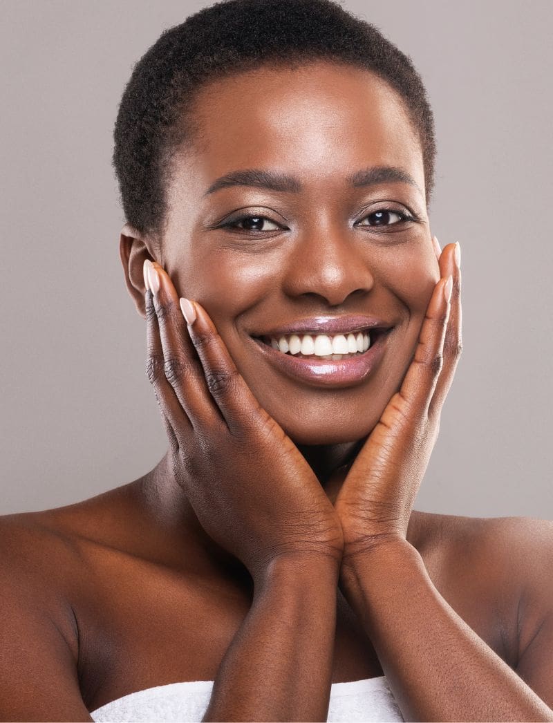 smiling woman with glowing skin