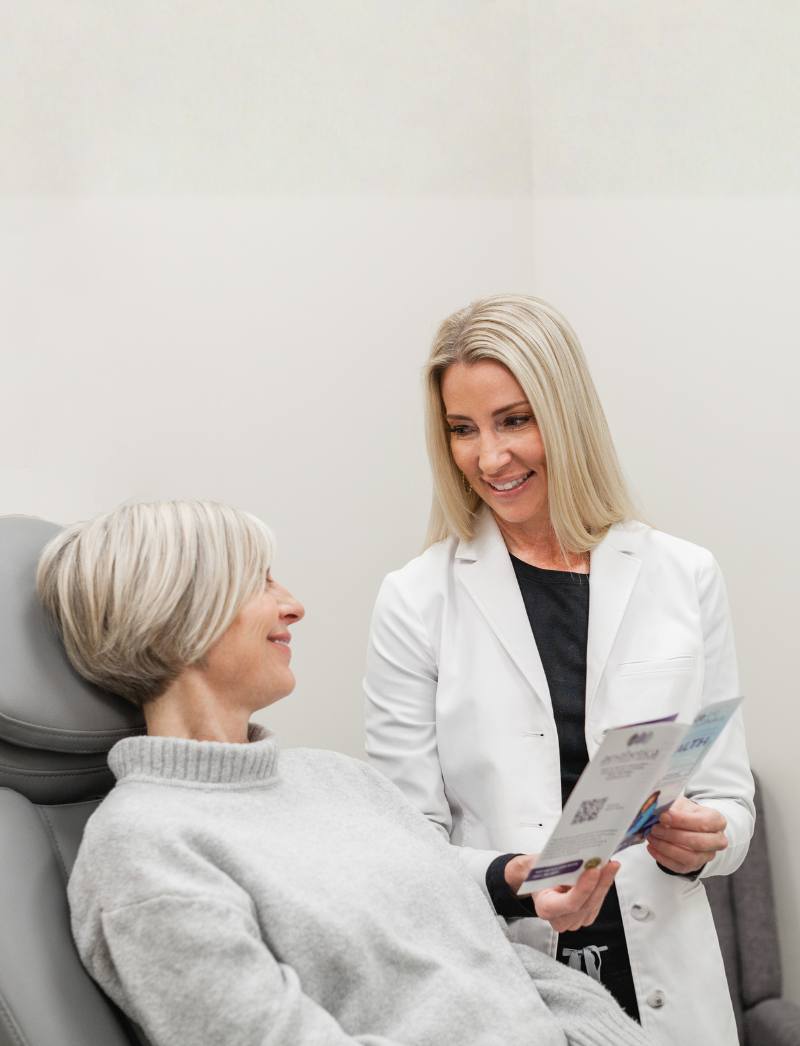 nurse with older patient hormone therapy